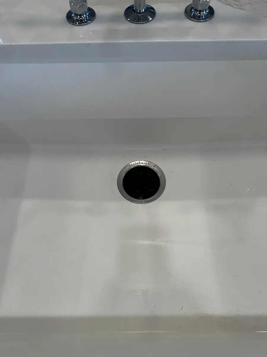 The same porcelain sink bright white, after